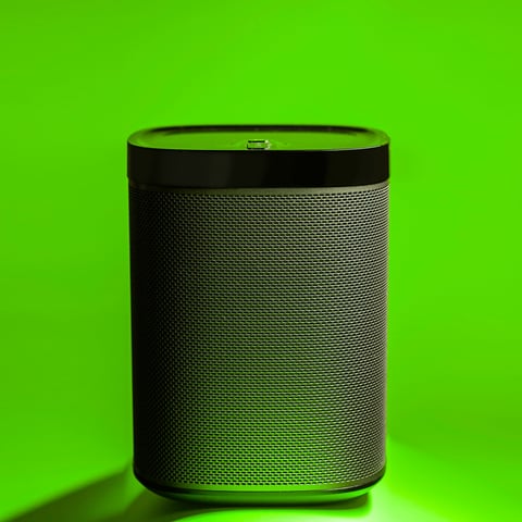 Black Wireless Speaker on Simple Colorful Background