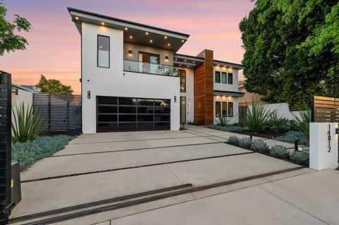 Modern home with pool at twilight